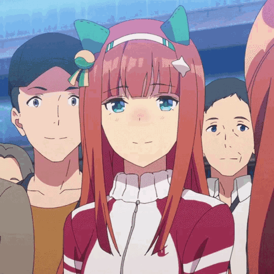a girl with red hair and green eyes is standing in a crowd