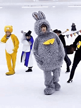 a group of people dressed in costumes including a bunny
