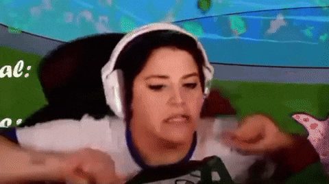 a woman is wearing headphones and playing a video game .