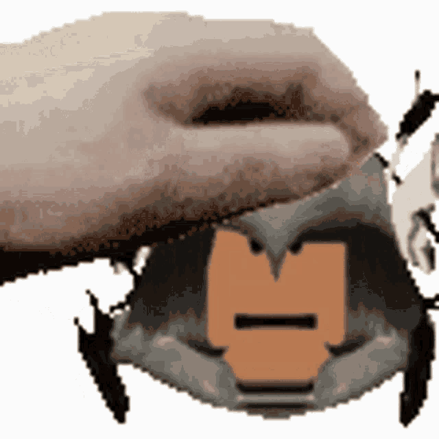 a hand is putting something on a cartoon character 's head with the letter m on it