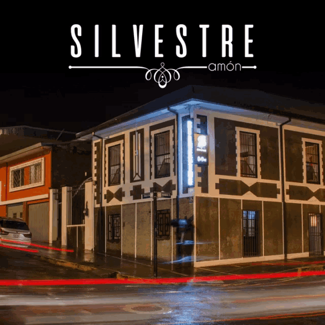 a poster for silvestre shows a building with a lot of windows