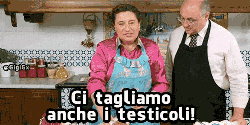 a man and a woman in a kitchen with the words ci tagliamo anche i testicoli
