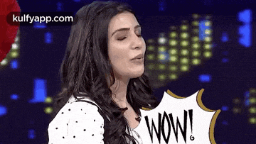 a woman is blowing a kiss with a wow speech bubble .