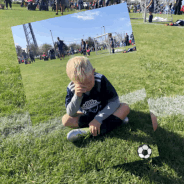 a young boy in a miller shirt sits on a soccer field