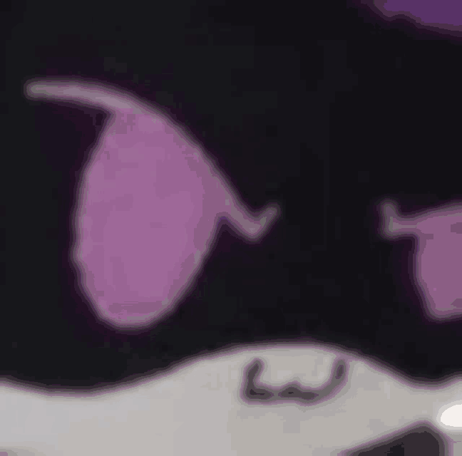 a close up of a purple eye on a black background